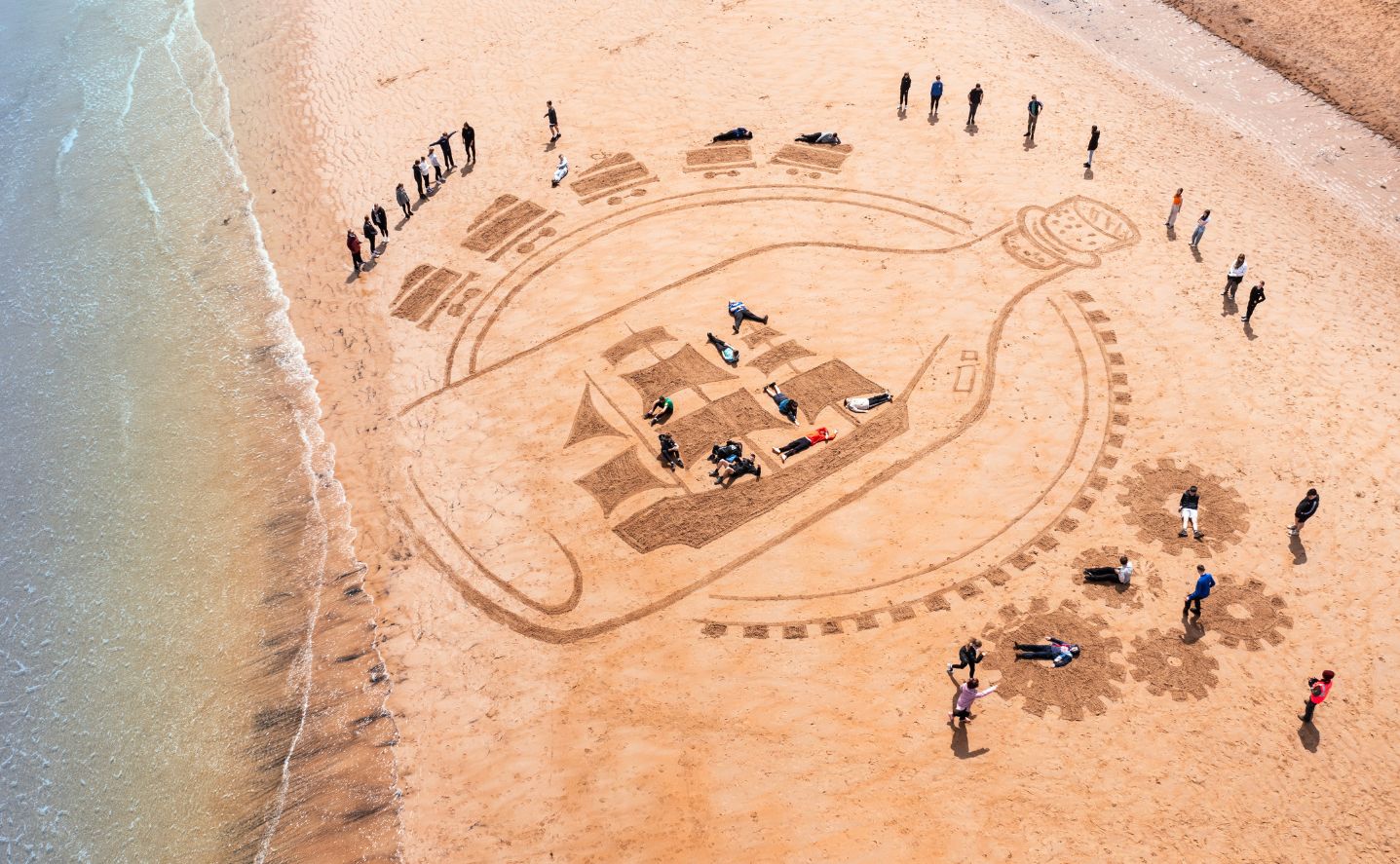 A ship in a bottle design in the sand